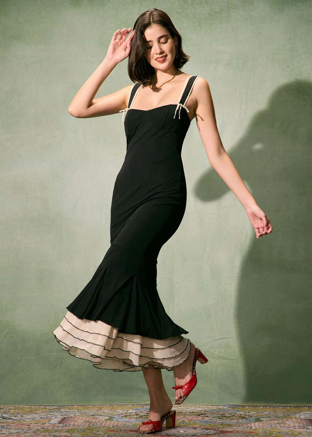 Tight black long dress with sweetheart neckline and thin straps